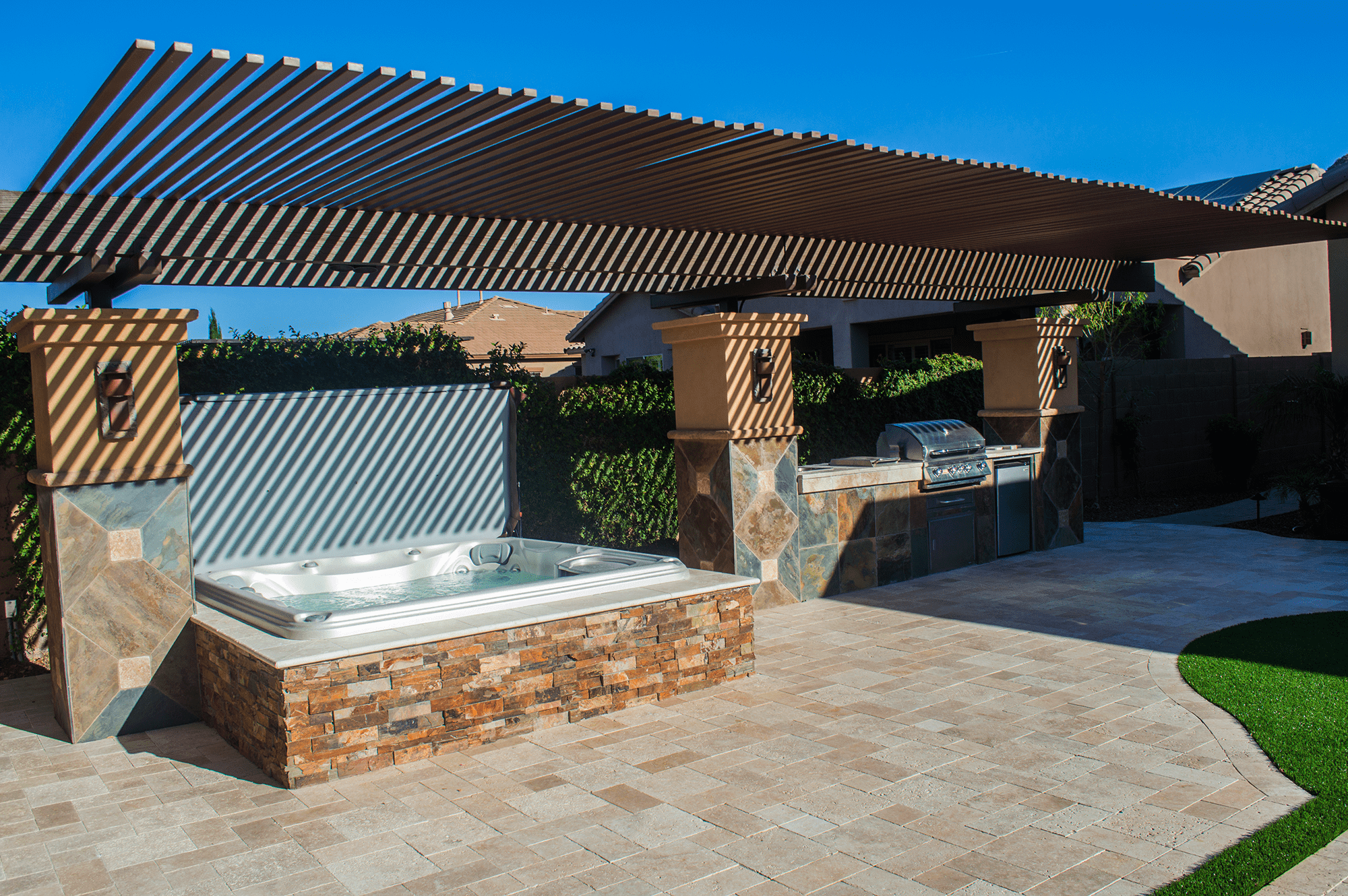 Sundance Spa installation covered by a pergola