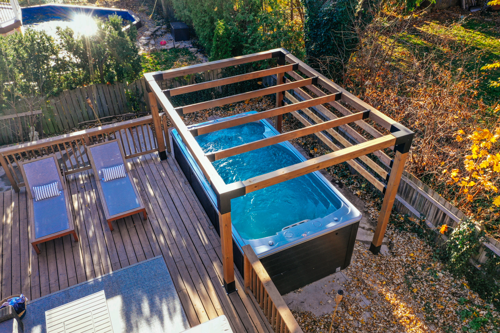 overview shot of swimlife swim spa under gazebo